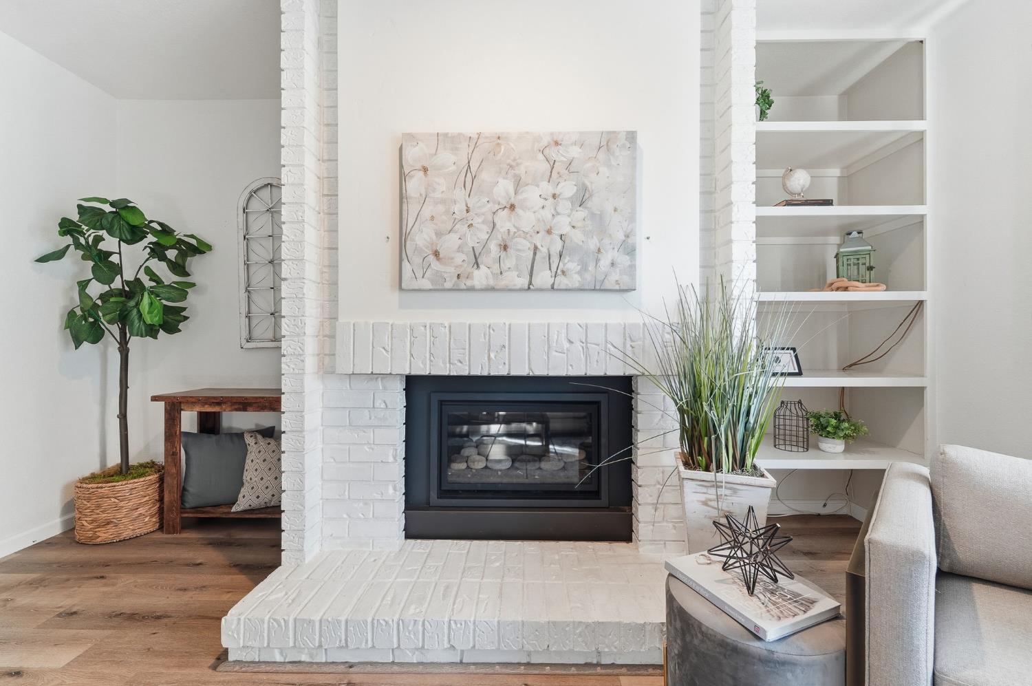 230 West Rumble Road, Unit C Modesto, CA 95350 - Photo 28 of 54 a living room with furniture and a fireplace