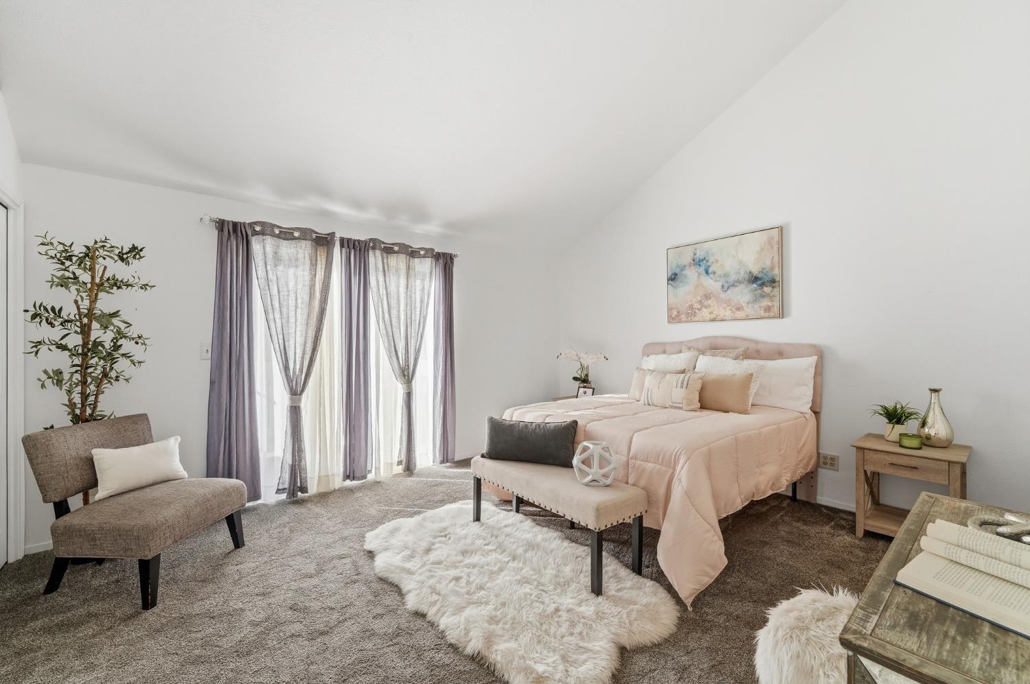 230 West Rumble Road, Unit C Modesto, CA 95350 - Photo 31 of 54 a bedroom with furniture and a window