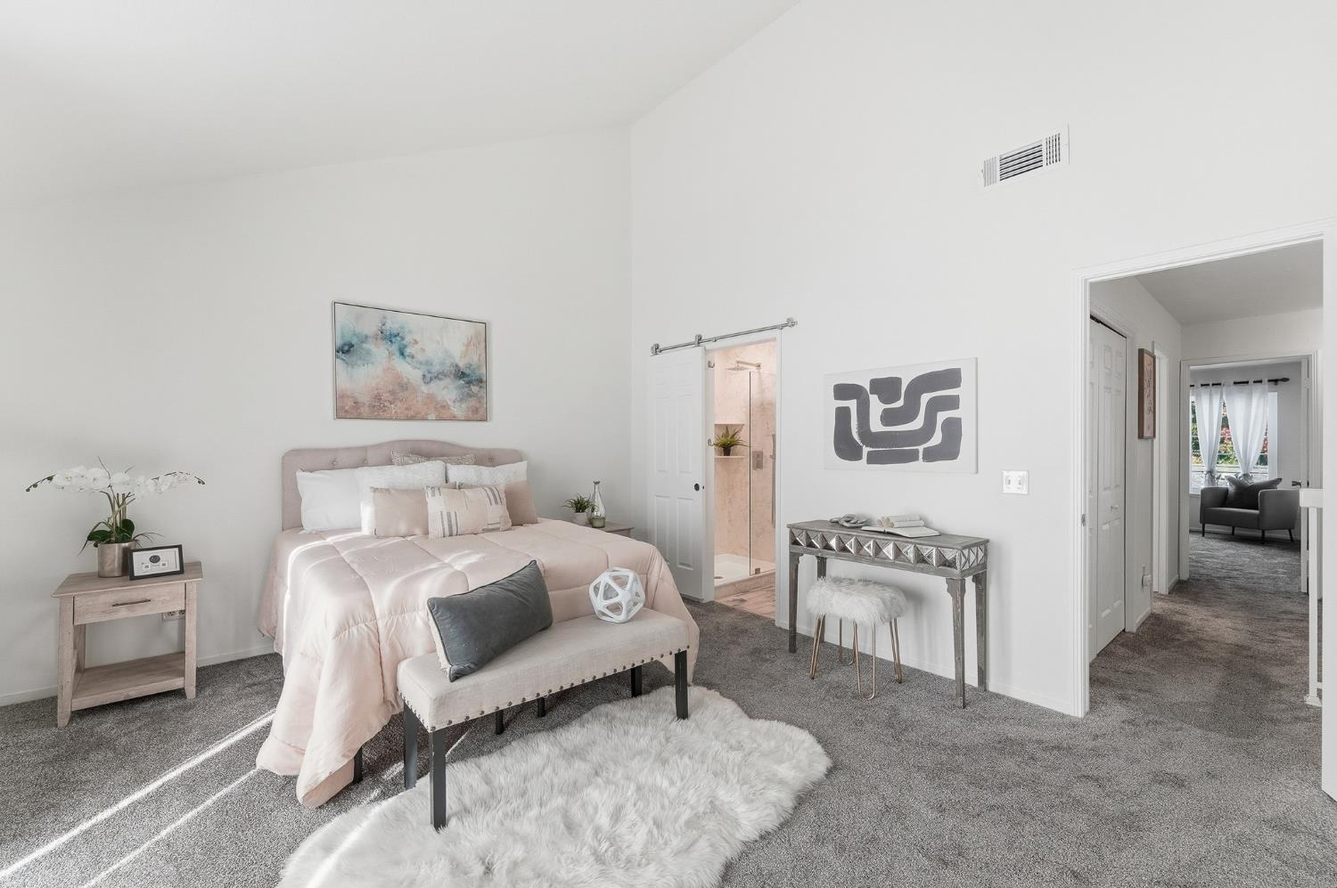 230 West Rumble Road, Unit C Modesto, CA 95350 - Photo 32 of 54 a bedroom with a bed and a table