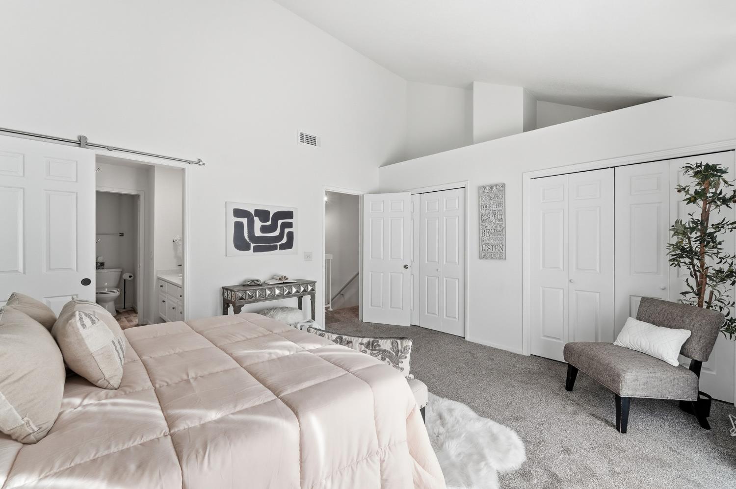 230 West Rumble Road, Unit C Modesto, CA 95350 - Photo 33 of 54 a bedroom with a bed and a couch