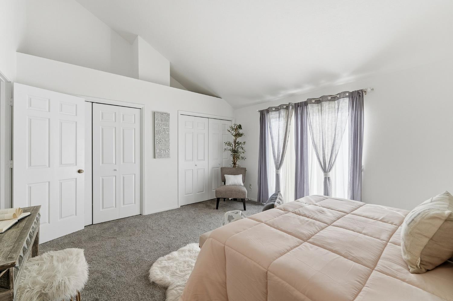 230 West Rumble Road, Unit C Modesto, CA 95350 - Photo 34 of 54 a bedroom with a bed and a window