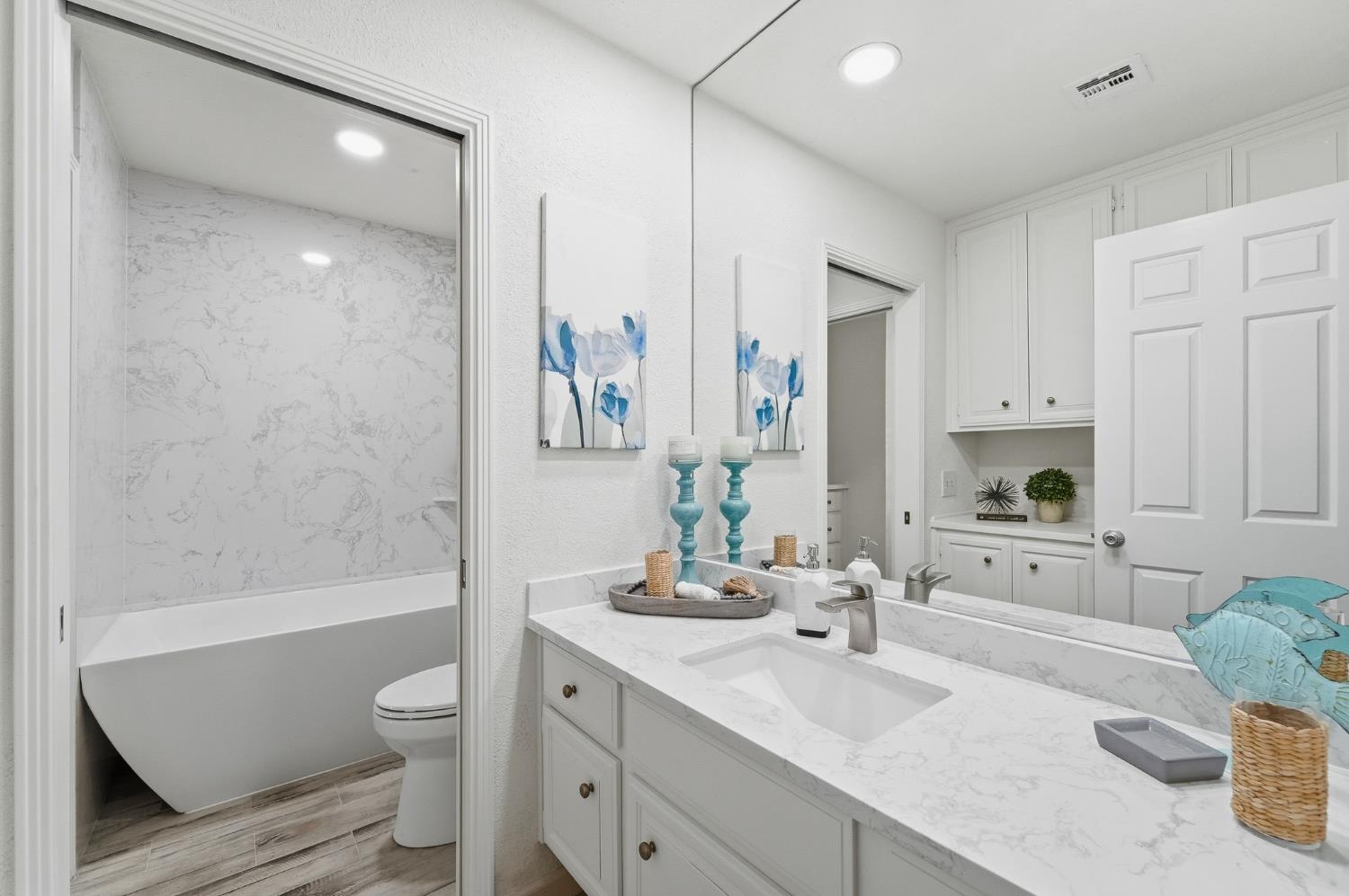 230 West Rumble Road, Unit C Modesto, CA 95350 - Photo 41 of 54 a bathroom with a granite countertop sink toilet tub and shower