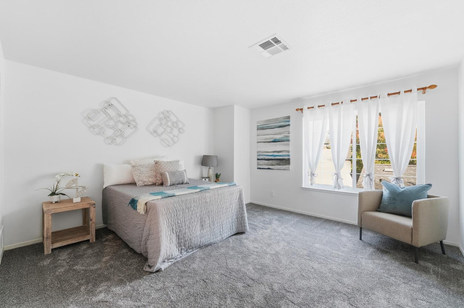 230 West Rumble Road, Unit C Modesto, CA 95350 - Photo 42 of 54 a bed room with furniture and a large window