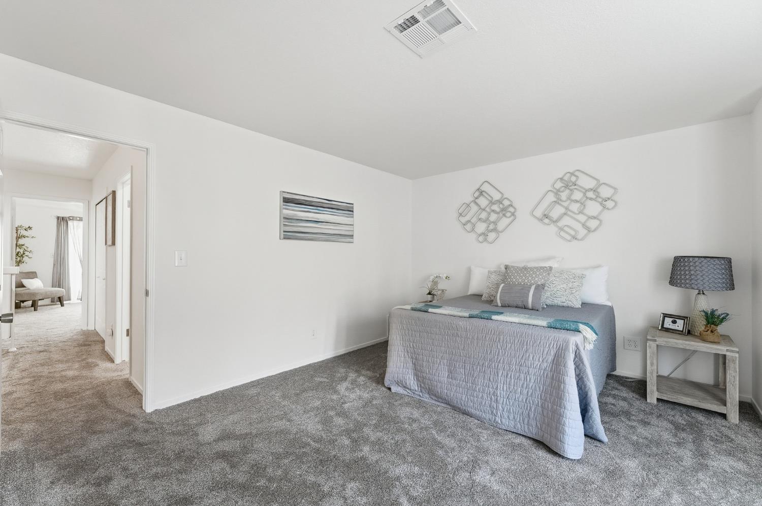 230 West Rumble Road, Unit C Modesto, CA 95350 - Photo 43 of 54 a living room with furniture and a table