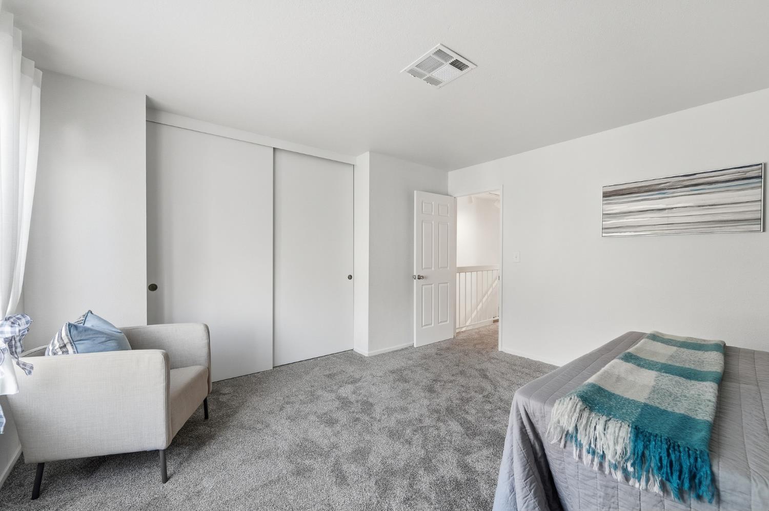 230 West Rumble Road, Unit C Modesto, CA 95350 - Photo 44 of 54 a bedroom with furniture and a bed