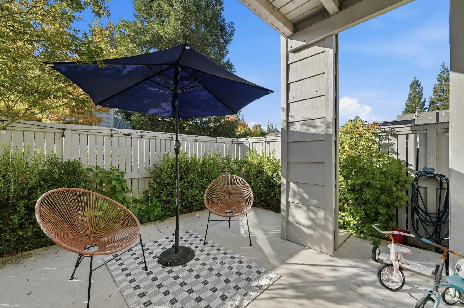 230 West Rumble Road, Unit C Modesto, CA 95350 - Photo 47 of 54 a backyard of a house with table and chairs