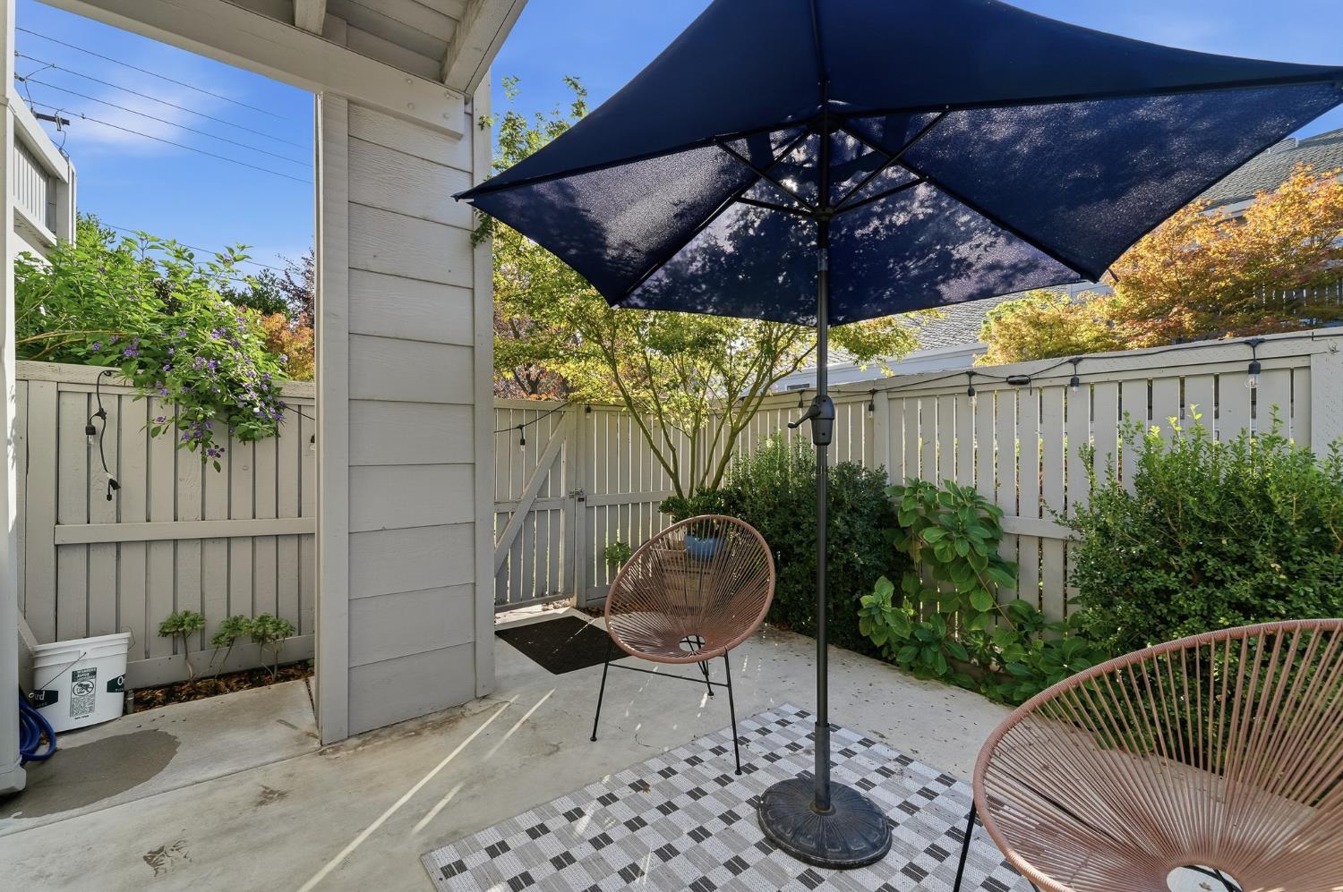 230 West Rumble Road, Unit C Modesto, CA 95350 - Photo 51 of 54 a patio with a patio table and chairs
