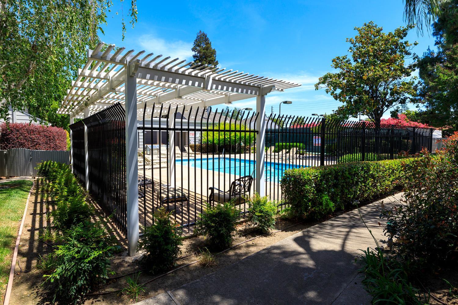 230 West Rumble Road, Unit C Modesto, CA 95350 - Photo 53 of 54 a front view of a house with a garden