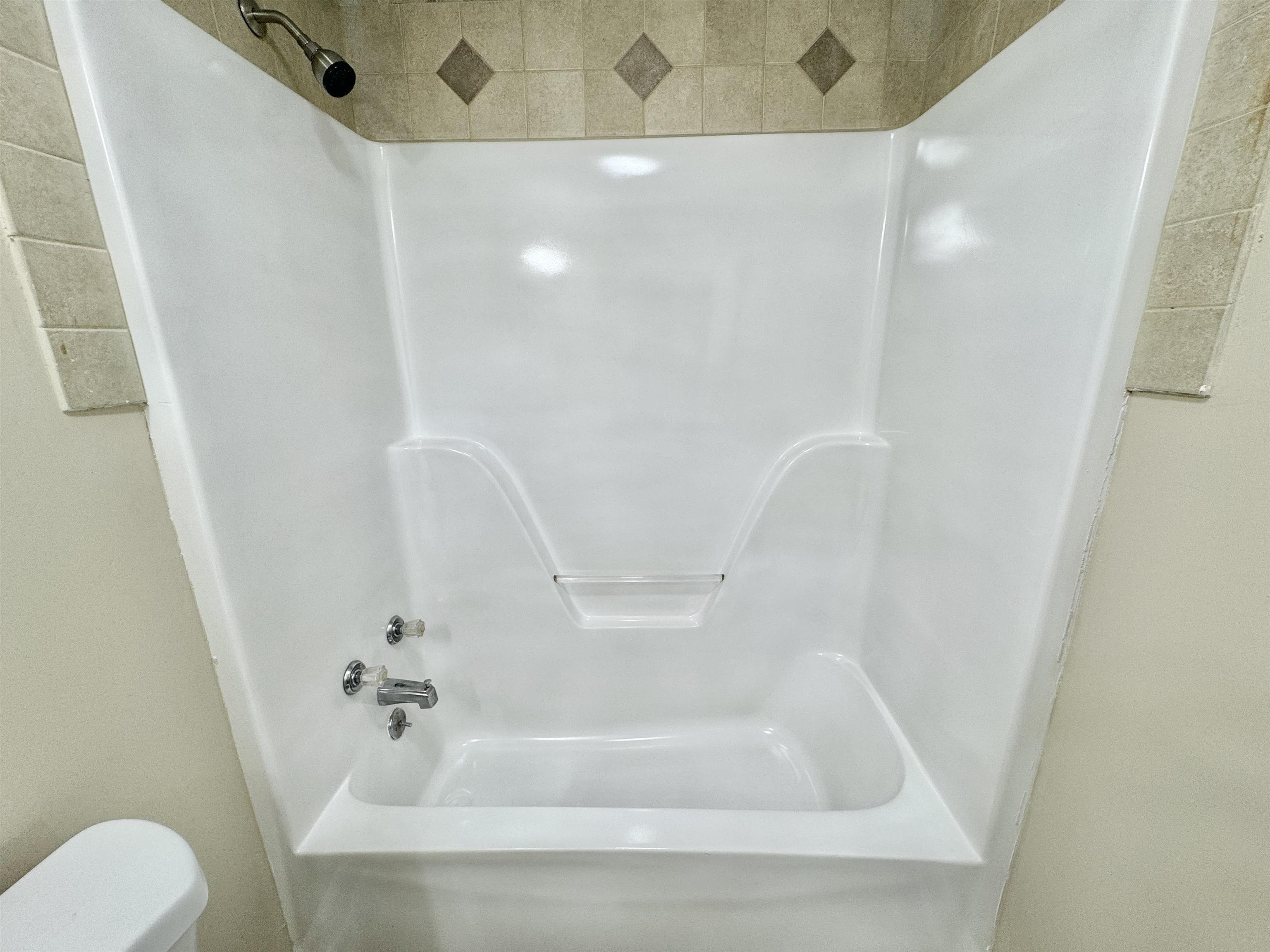 6889 Fulton Road Brownsville, TN 38012 - Photo 25 of 40 Bathroom with tub / shower combination and toilet