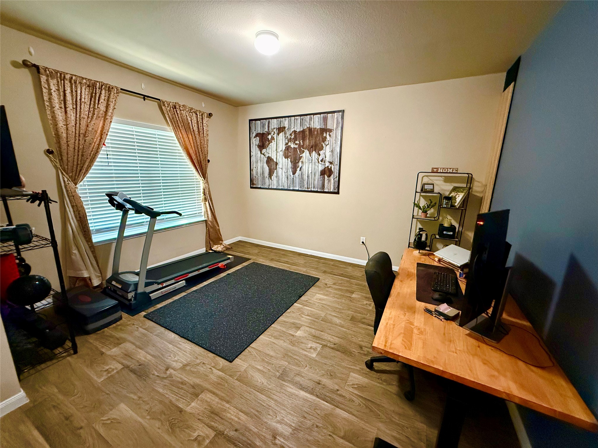 11700 Andesite Road Manor, TX 78653 - Photo 26 of 32 Functional office space featuring hardwood-style flooring and a well-lit environment.