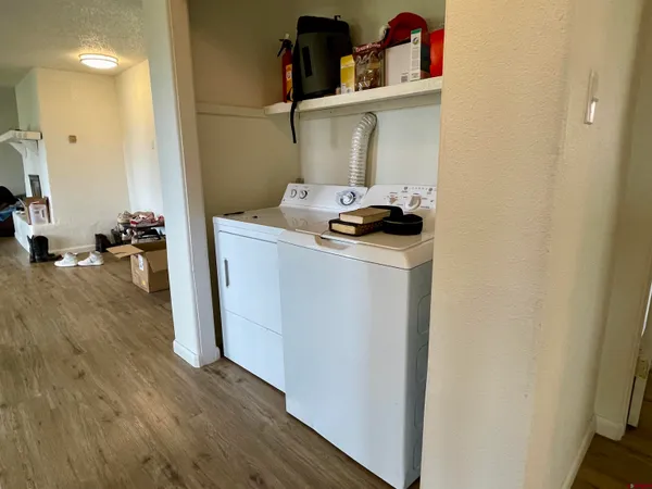 a spacious bedroom with a bed and a flat screen tv