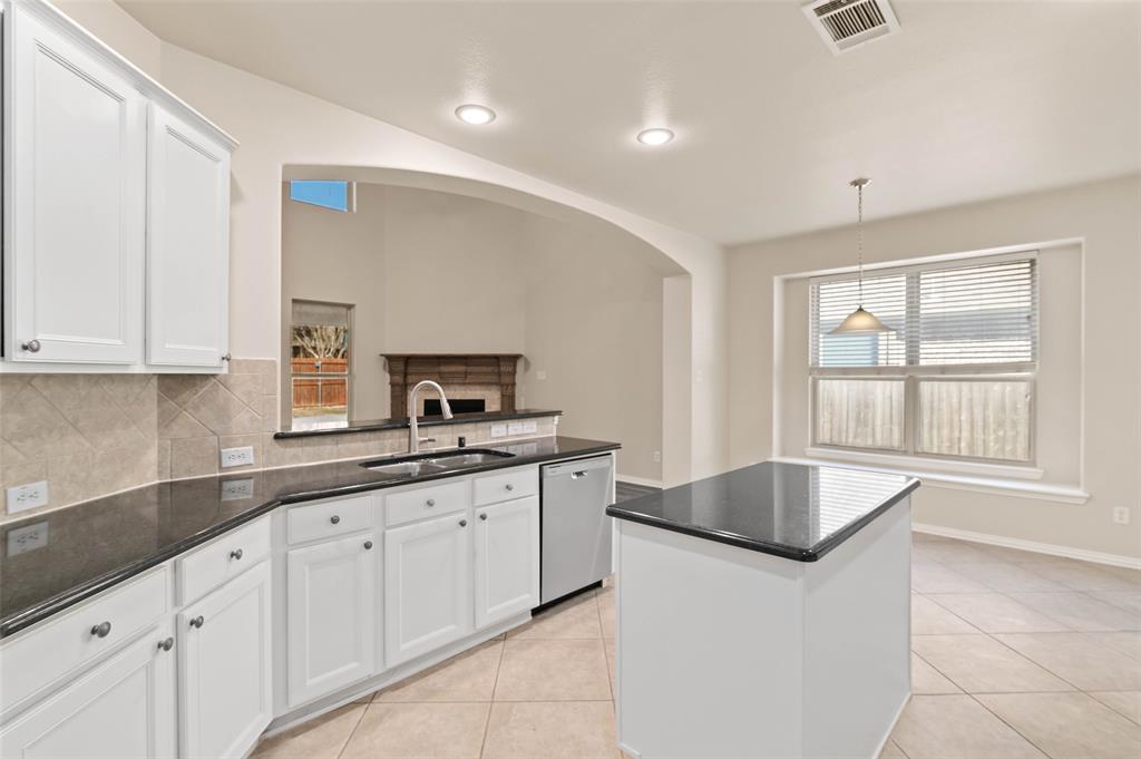 7509 Barrymore Road Denton, TX 76208 - Photo 11 of 40 Large eat-in kitchen with island and breakfast area