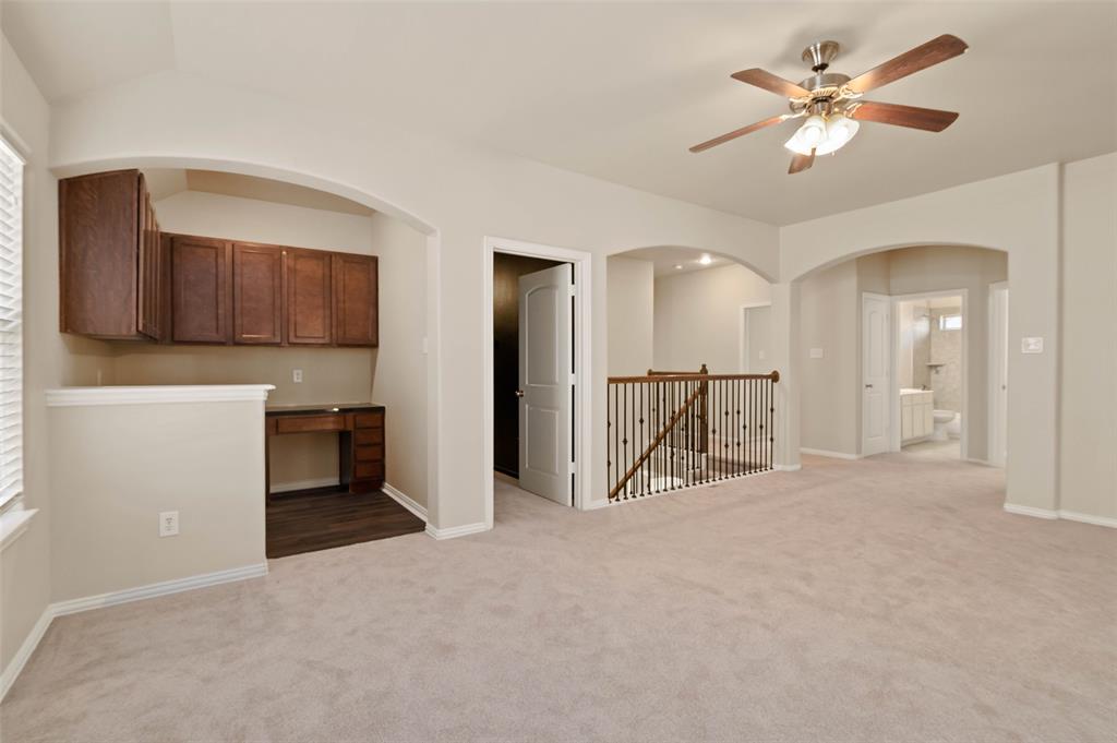 7509 Barrymore Road Denton, TX 76208 - Photo 24 of 40 Upstairs living area with built in desk office area