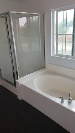 a bathroom with a bathtub and a sink