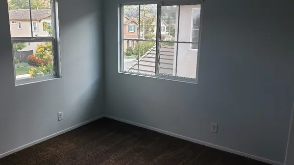 an empty room with windows