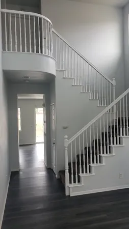 a view of entryway with wooden floor