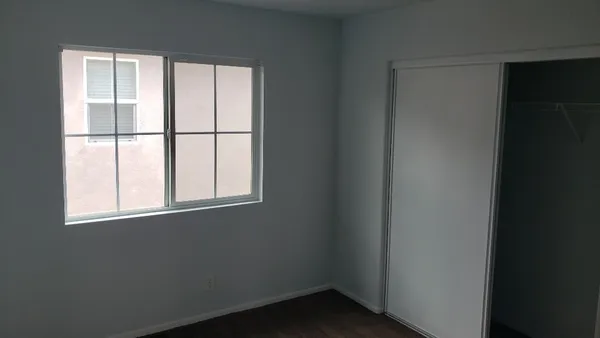 a view of an empty room with a window