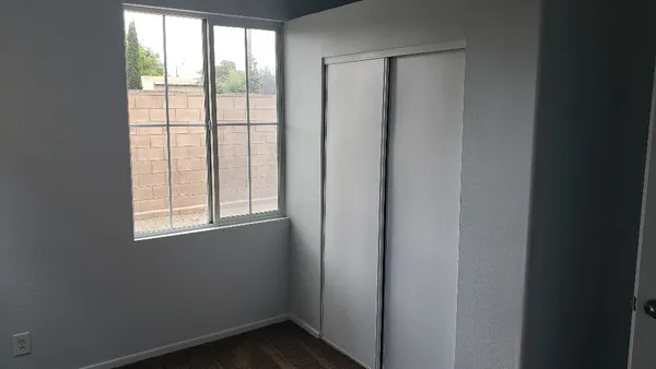 a view of an empty room with a window