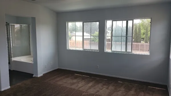 wooden floor and window in an empty room