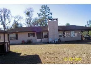 12940 Northeast 75th Street Bronson, FL 32621 - Photo 1 of 1 a view of a house with a yard