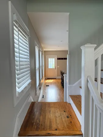 a view of a living room and dining room