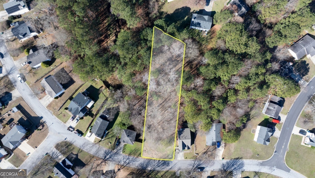 an aerial view of residential house with outdoor space