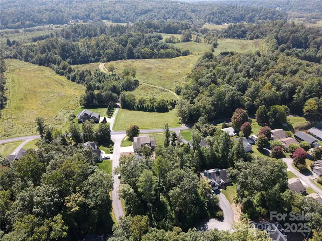 a view of lake and houses with outdoor space