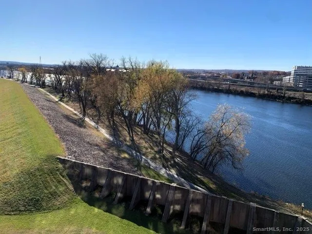 a view of swimming pool with outdoor seating and yard