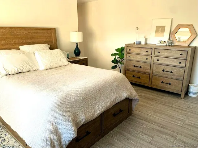 a bedroom with a bed and a dresser
