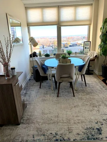 a view of a porch with furniture and a yard