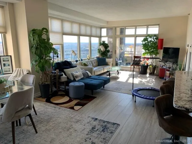 a living room with furniture fireplace and a flat screen tv