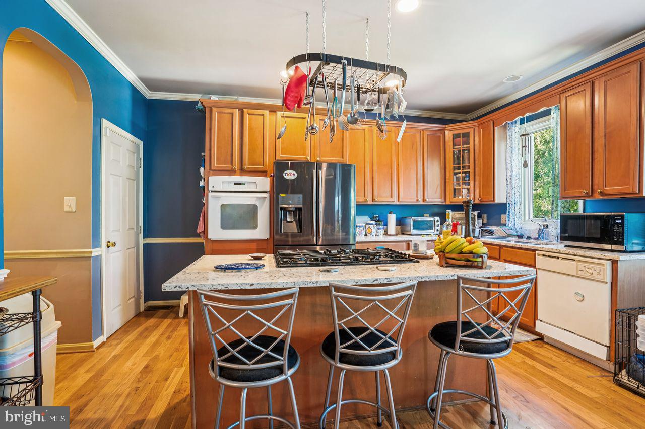 6418 Sligo Mill Road Takoma Park, MD 20912 - Photo 10 of 40 Kitchen center island with gas cook top
