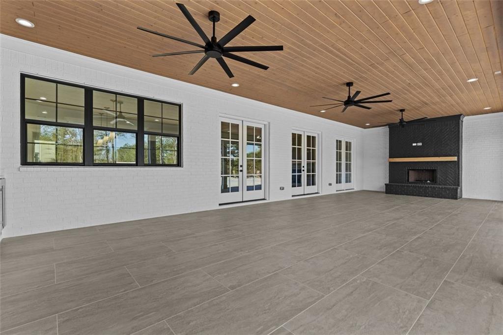 2355 Luke Edwards Road Dacula, GA 30019 - Photo 105 of 115 a view of an empty room with a window and a chandelier fan