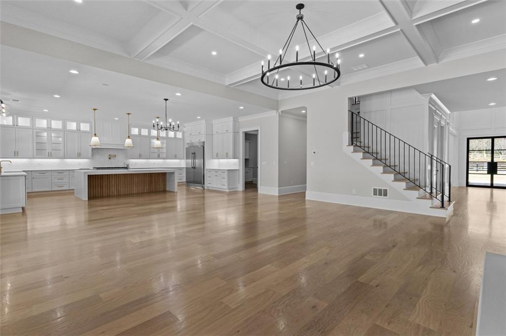 2355 Luke Edwards Road Dacula, GA 30019 - Photo 15 of 115 a view of a dining room with furniture wooden floor and chandelier