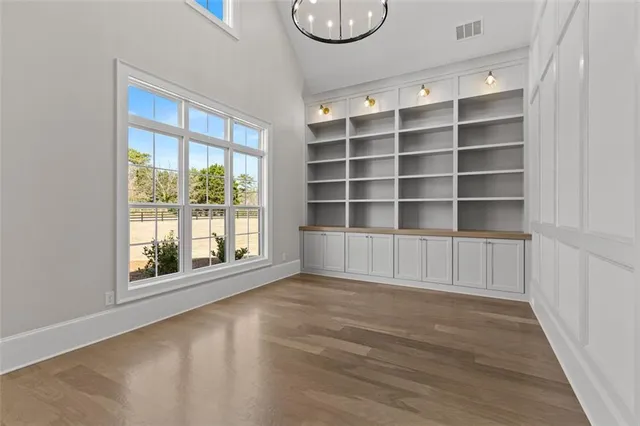 a kitchen with white cabinets and a stove