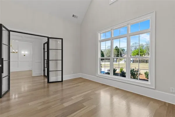 a view of walk in closet with empty racks