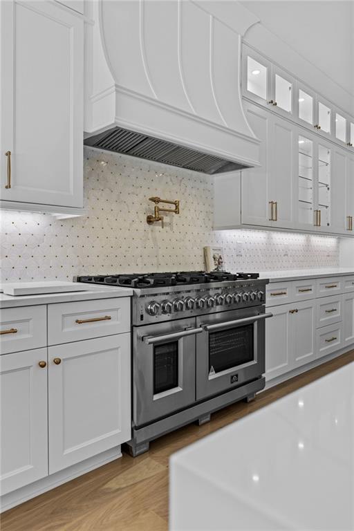 2355 Luke Edwards Road Dacula, GA 30019 - Photo 31 of 115 a kitchen with granite countertop white cabinets and appliances