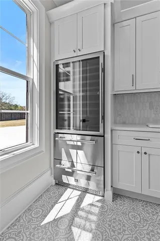 a kitchen with a stove and a microwave