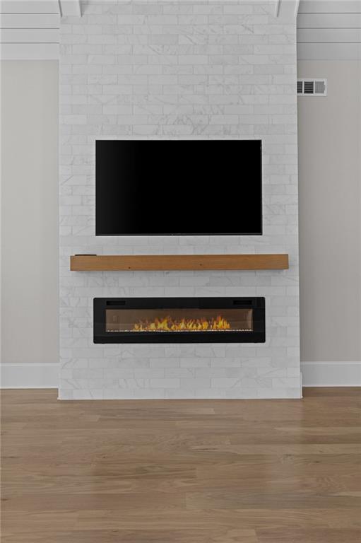 2355 Luke Edwards Road Dacula, GA 30019 - Photo 50 of 115 a living room with a flat screen tv and a fireplace