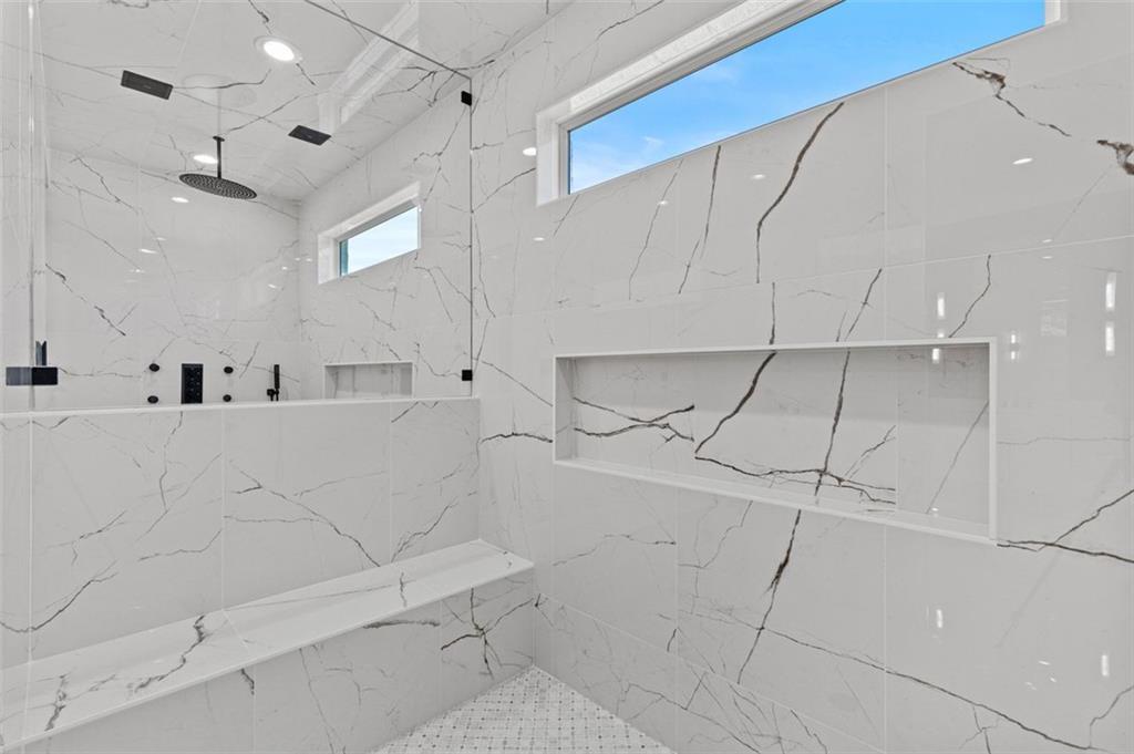 2355 Luke Edwards Road Dacula, GA 30019 - Photo 53 of 115 a bathroom with a bathtub and a shower