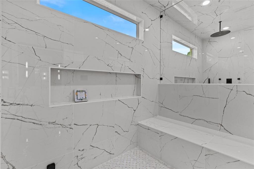 2355 Luke Edwards Road Dacula, GA 30019 - Photo 55 of 115 a bathroom with a bathtub and a shower