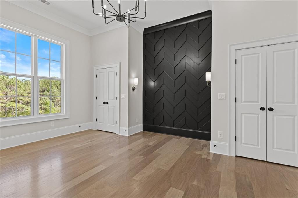 2355 Luke Edwards Road Dacula, GA 30019 - Photo 67 of 115 a view of an empty room with wooden floor and a window