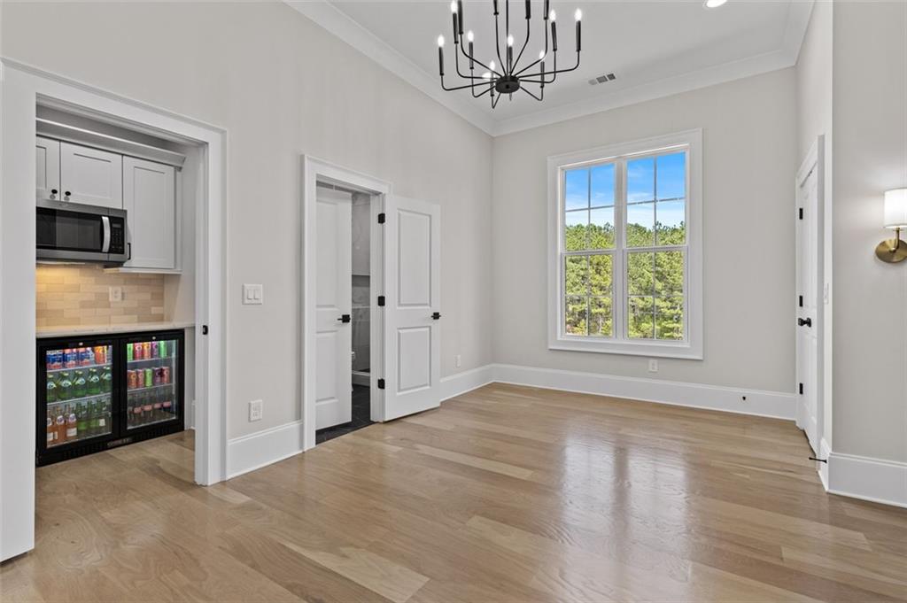 2355 Luke Edwards Road Dacula, GA 30019 - Photo 68 of 115 wooden floor in an empty room with a window