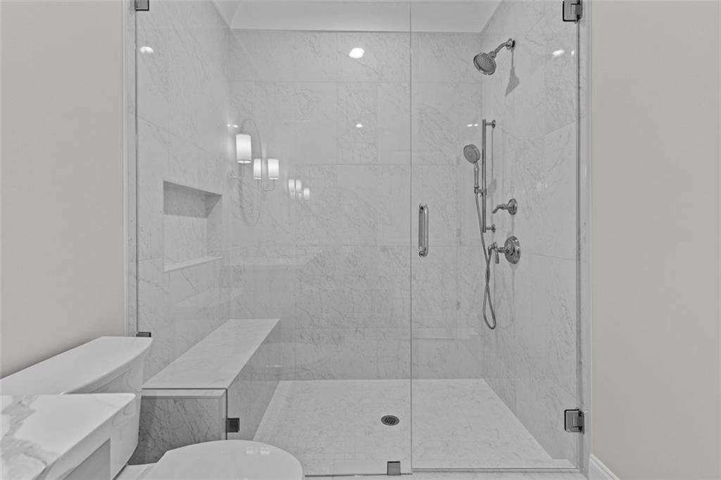 2355 Luke Edwards Road Dacula, GA 30019 - Photo 74 of 115 a bathroom with a shower and toilet