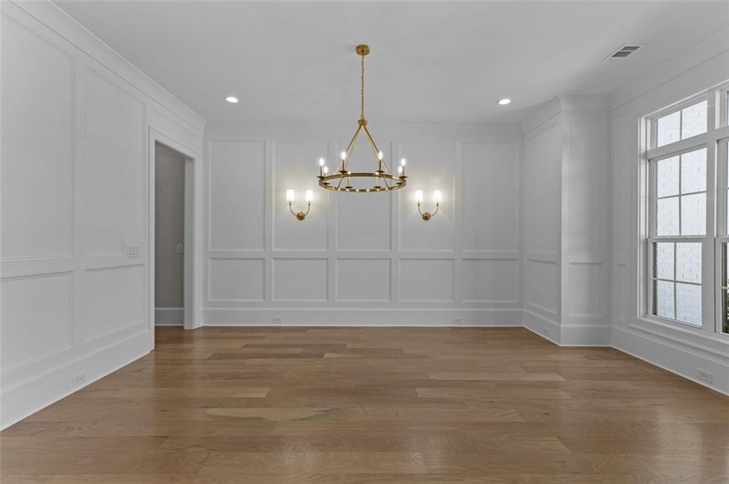 2355 Luke Edwards Road Dacula, GA 30019 - Photo 8 of 115 wooden floor in an empty room with a window