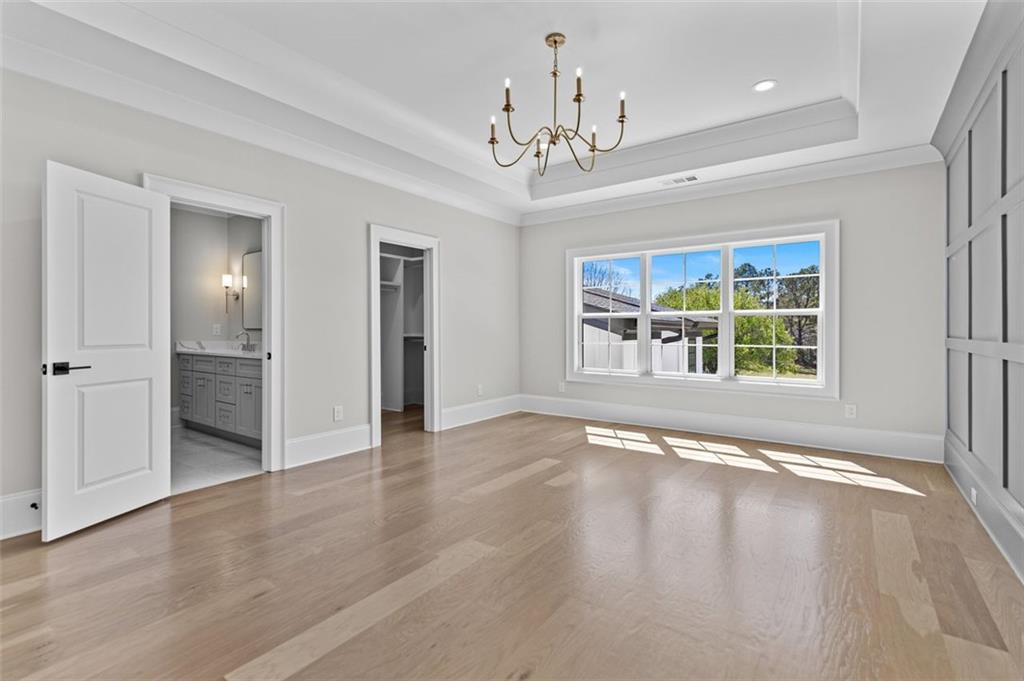 2355 Luke Edwards Road Dacula, GA 30019 - Photo 83 of 115 a view of an empty room with wooden floor and a window