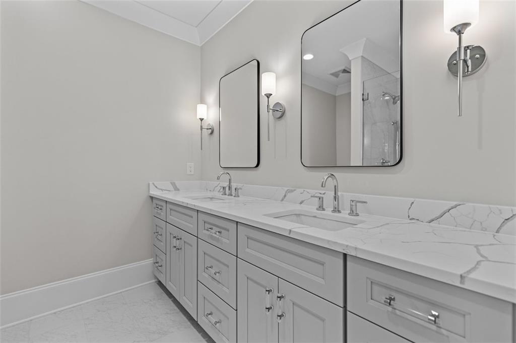 2355 Luke Edwards Road Dacula, GA 30019 - Photo 85 of 115 a bathroom with a double vanity sink and mirror