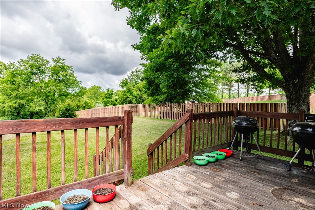 279 Spence Road Belpre, OH 45714 - Photo 34 of 40 Wooden terrace featuring grilling area and a lawn