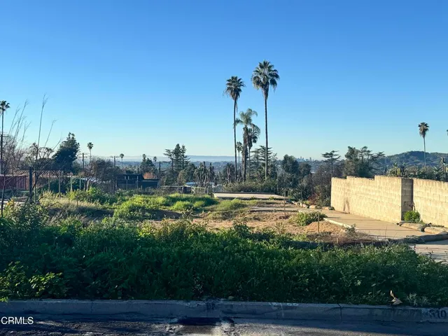 a view of a swimming pool and a yard