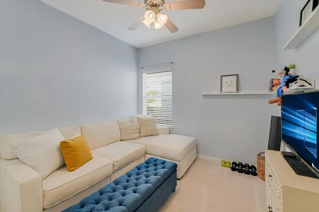 a living room with furniture and a window